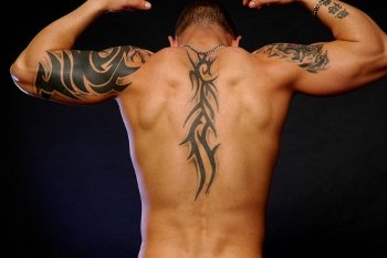 Man with tattoo on spine