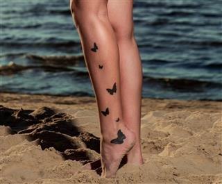 Sexy Brunette On The Beach