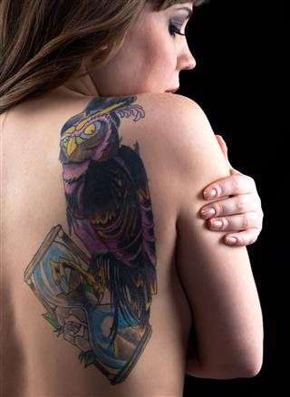 Woman With Tattoo From Back