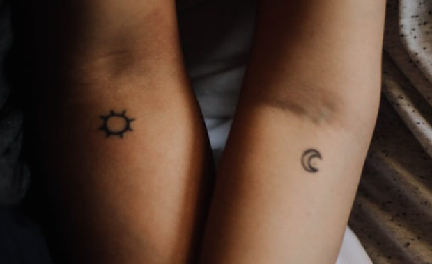 matching sun & moon tattoo on two different people